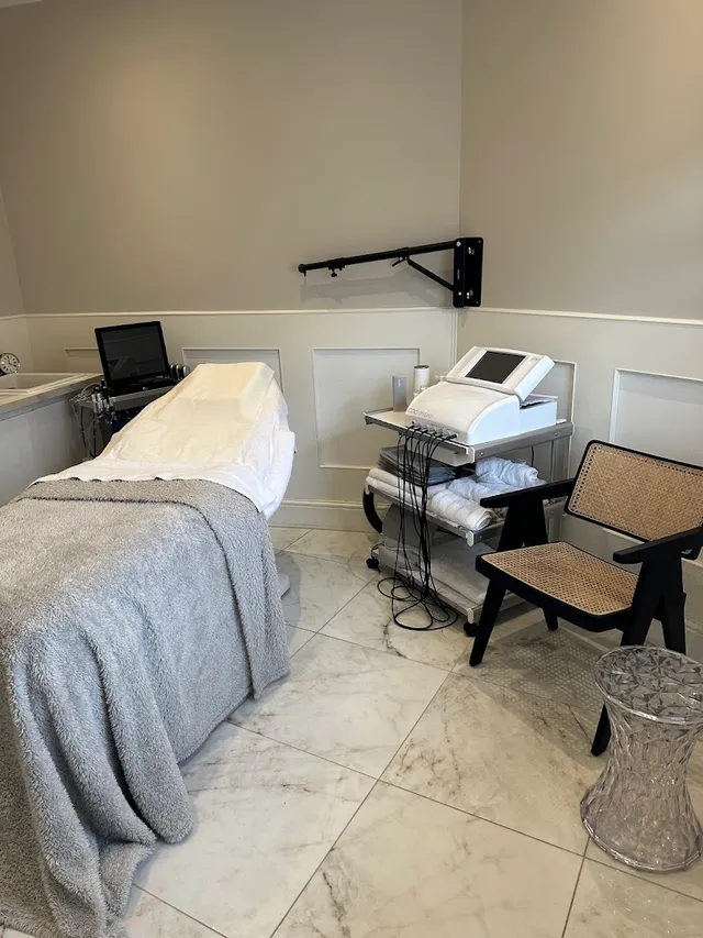 A calm treatment room with marble floors and CACI technology
